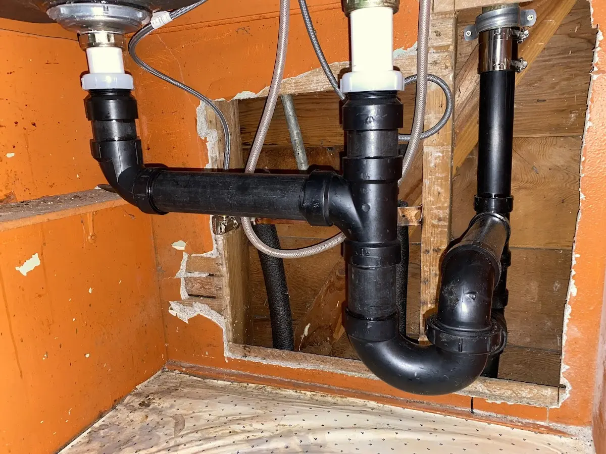 Professional Garbage Disposal Repair equipment and tools on the job in Ross